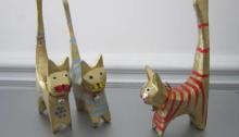 three wooden cat figurines