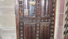wooden door with crown emblem